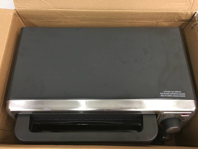 lot 101 image: Black & Decker 4-Slice Toaster Oven, Stainless Steel