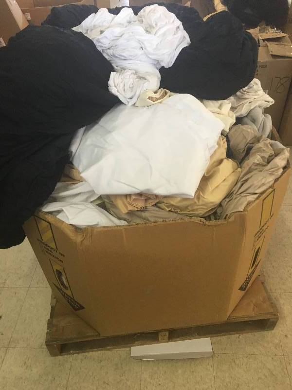 lot 179 image: Large gaylord of new sheets and curtains and bed sets  they just need to be sorted  these are new
