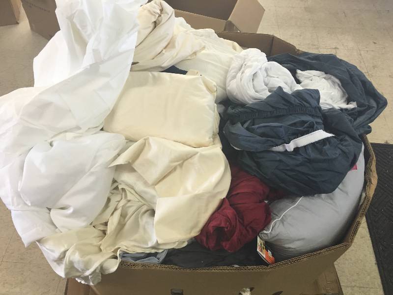 lot 180 image: Large gaylord of new sheets and curtains and bed sets  they just need to be sorted  these are new