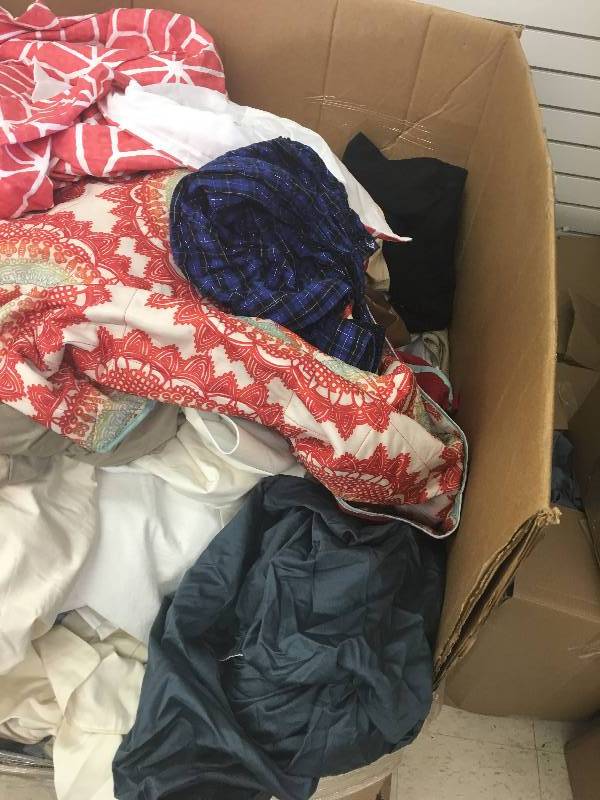 lot 181 image: Large gaylord of new sheets and curtains and bed sets  they just need to be sorted  these are new