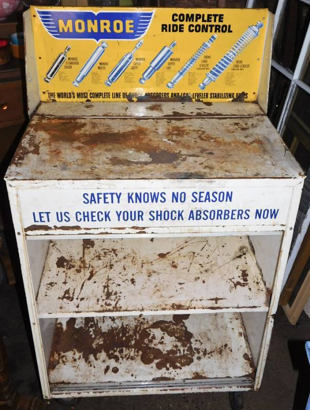 lot 1 image: Vintage Monroe Shock Absorber Rolling Store Display Cabinet