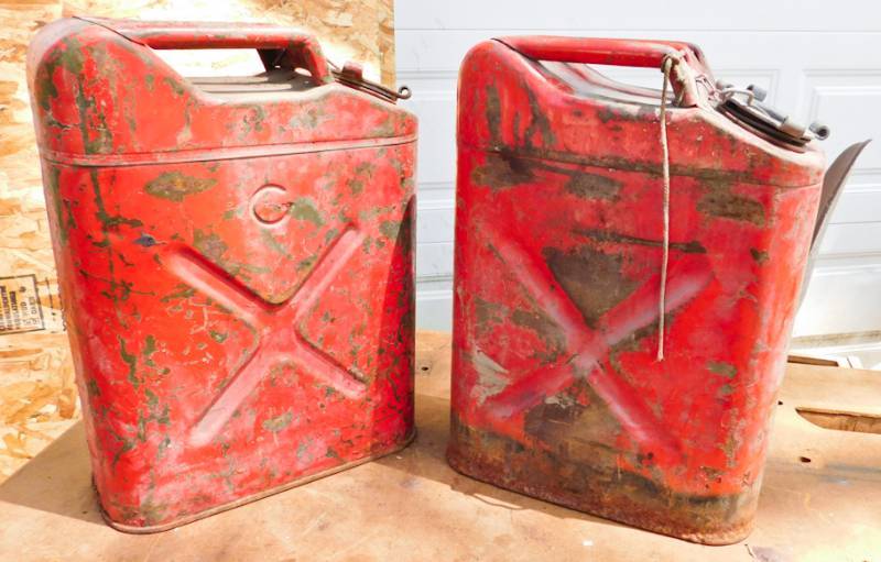 lot 94 image: 2 red 5 gallon gas cans Jerry Cans