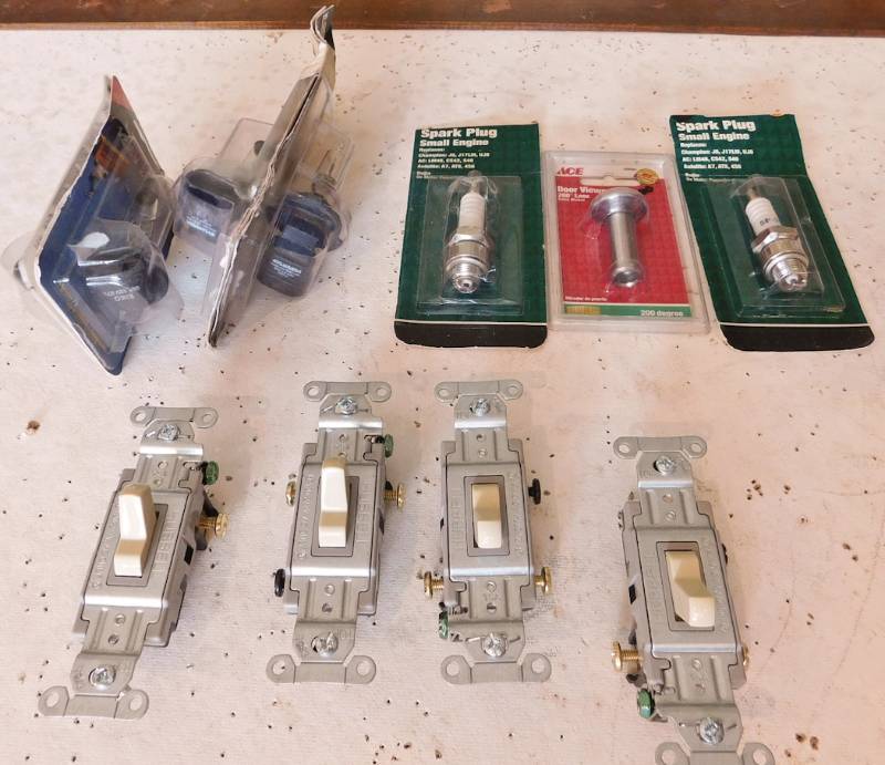 lot 23 image: light switches, light bulbs spark plugs and door viewer