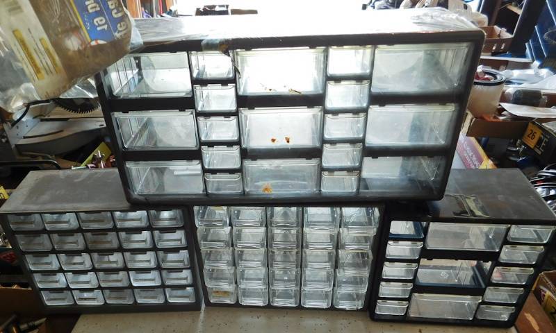 lot 35 image: lot of 4 plastic organizers most all drawers are there