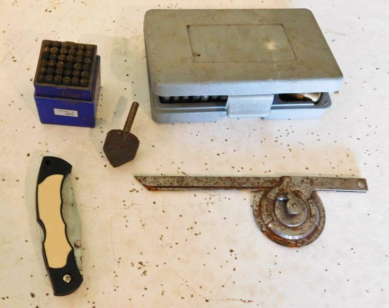 lot 52 image: number and letter punches pocket knife and more