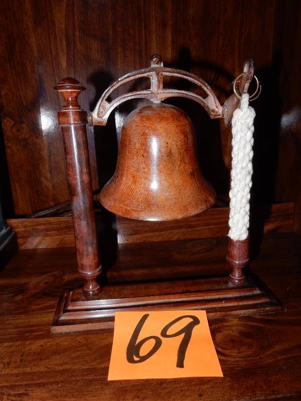 Nice FAUX Wood Dinner bell.. Approx 10 in H
