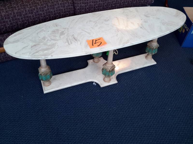 Marble Coffee table.. Long Oval shaped with Marble Base and decorative columns
