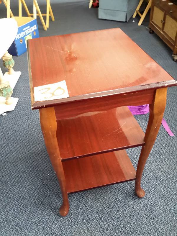Side table with 2 shelves.  Solid wood Queen Anne style legs.  Simulated wood top and shelves.