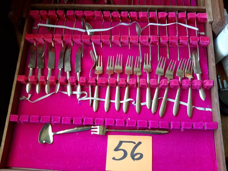 Large set of Gold Colored Silver Plate as pictured.. Includes case