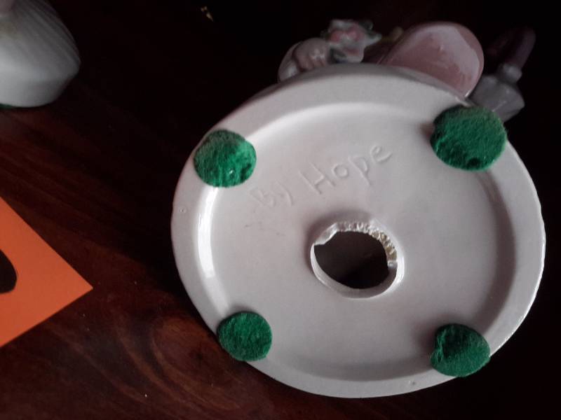2 Children porcelain statues.. 10 in h.. Made by HOPE