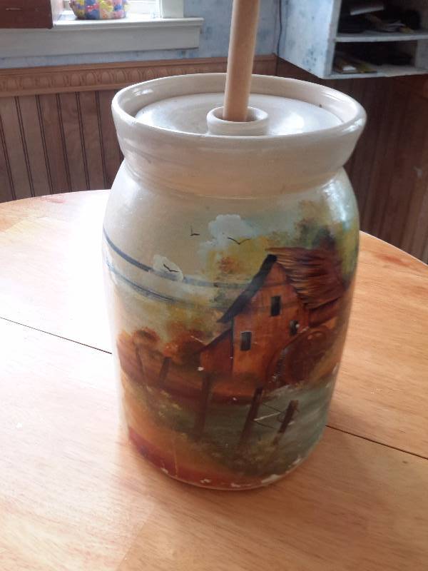 Butter Churn Crock with painting.. Top has a crack
