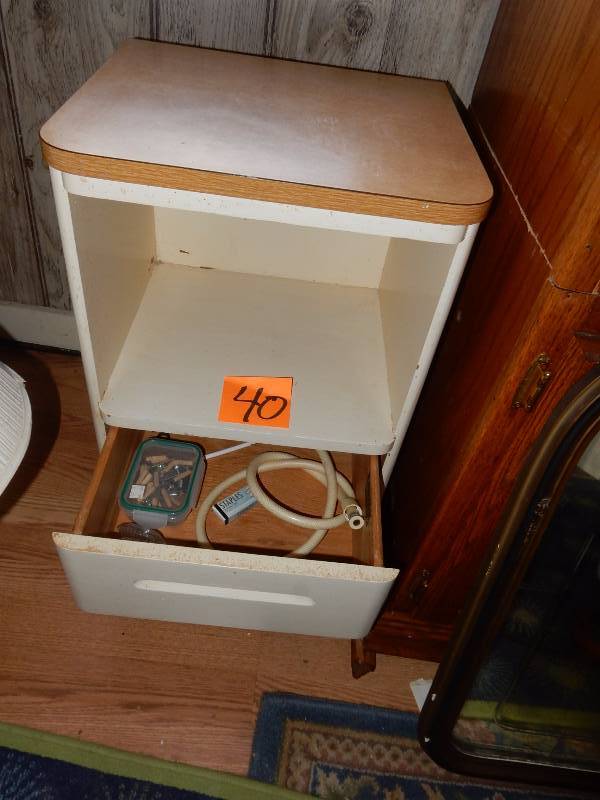 Mid Mod style side table. Simulated wood top.. Solid wood body..