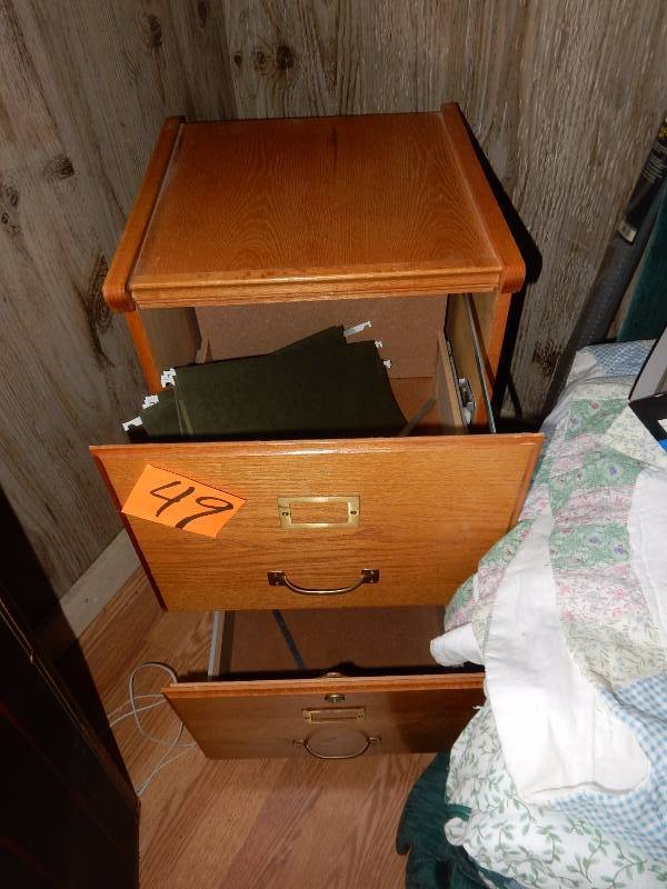 Wood letter size file cabinet.. Drawers roll well.  No key