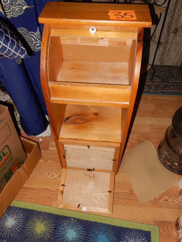 Small Wood Cabinet with Roll top and two flip cabinets.. Nothing in side.