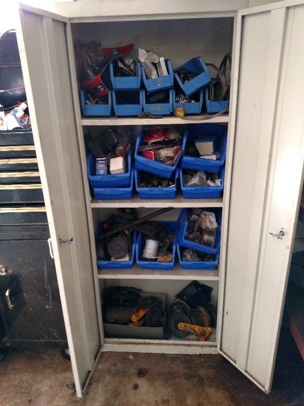 lot 69 image: 2-door Cabinet with Asstd Mower Pa...