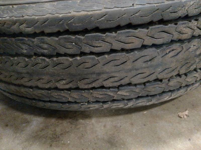 lot 106 image: Goodyear H78-15ST Tire on Chevy Rim...