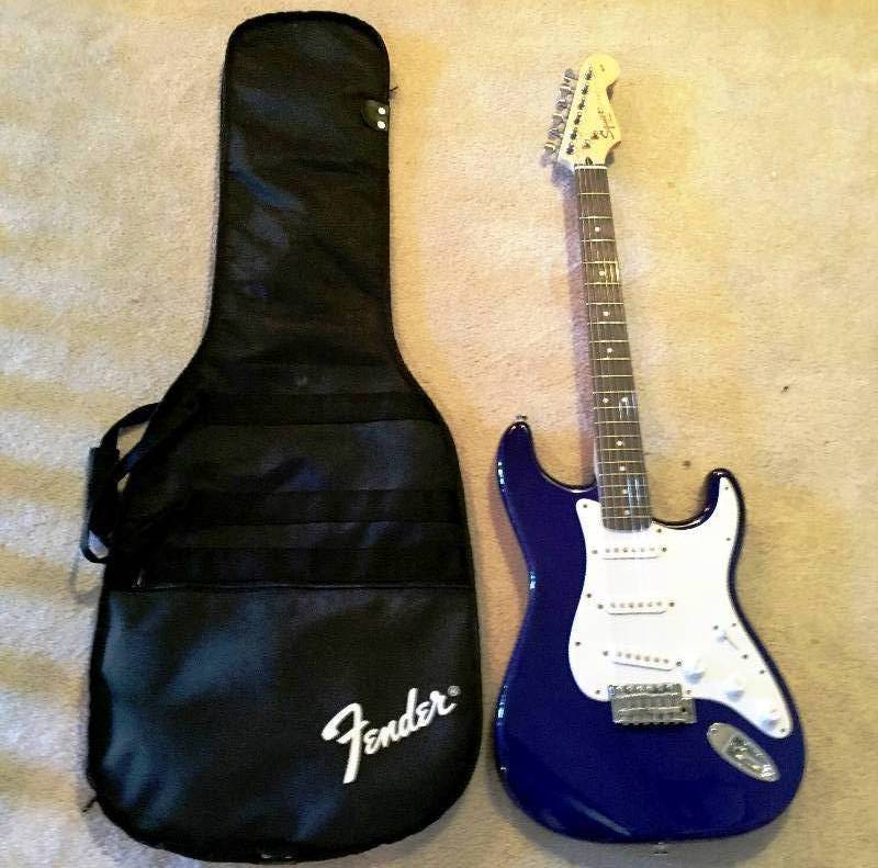 lot 126 image: Fender Squier Strat Stratocaster Metallic Baltic Blue Electric Guitar Made in Indonesia With Gigbag Excellent Condition