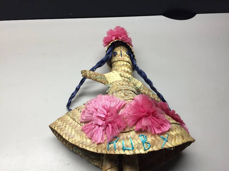 lot 8 image: DOLLS, CLOCKS, PLACE MATS FLOWER POTS AND WICKER BASKETS