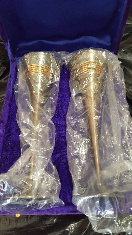 Two bronze goblets in purple case.