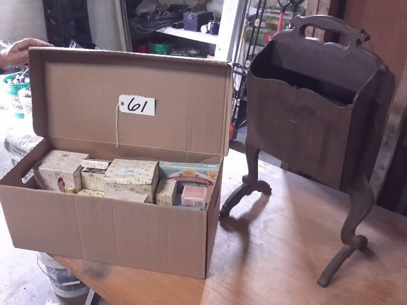 lot 61 image: Vintage solid wood Magazine Rack..  18 in w x 29 in h  box of Precious Moments statuettes and items