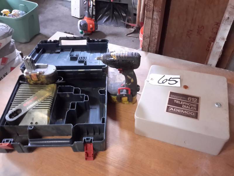lot 65 image: Bosch 12 in Impact Driver with Charger and Extra battery  ADEMCO Telephone Dialer
