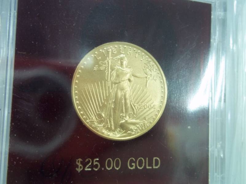 lot 4 image: $25 Gold American Eagle 12 Oz. Fine Gold Coin with Certificate of Authenticity