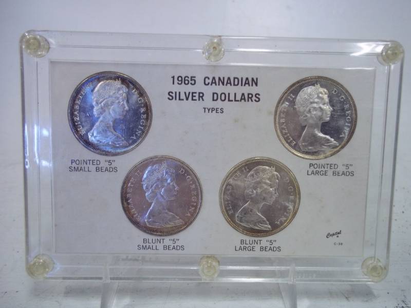 lot 12 image: 4 1965 Canadian Silver Dollars in case
