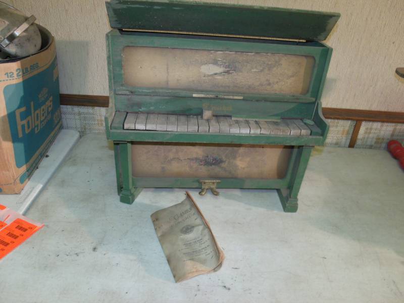 lot 122 image: Old Childs Piano with book