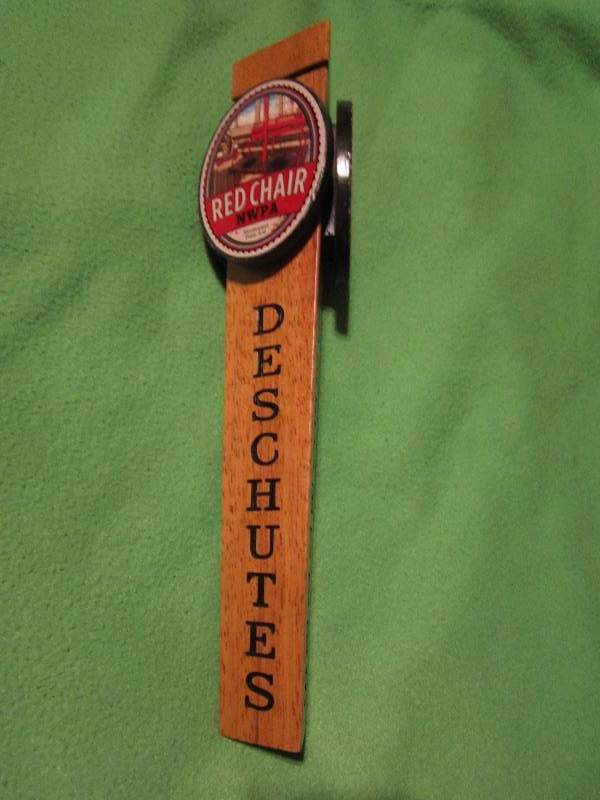 lot 50 image: Red chair NWPA deschutes beer tap...