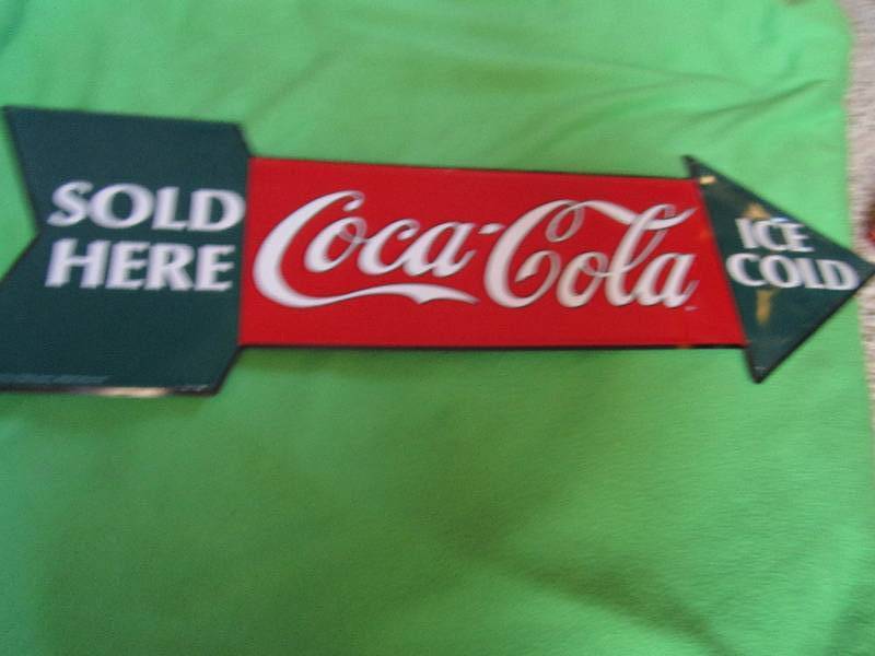 lot 94 image: Ice cold Coca-cola sold here sign...