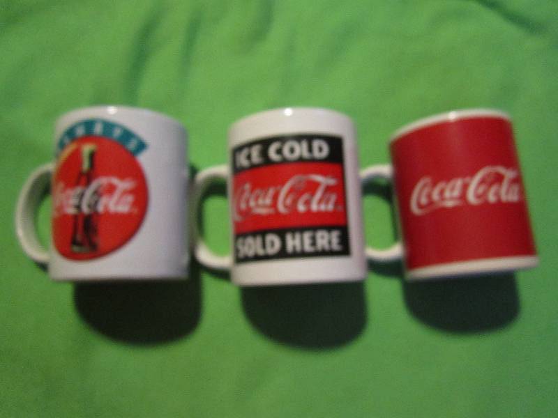 lot 108 image: Set of 3 Coca-cola mugs...