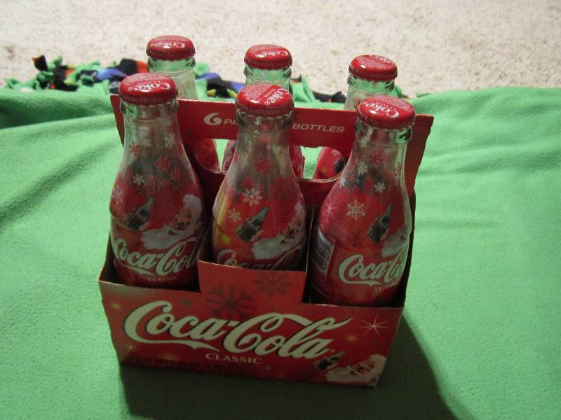 lot 133 image: Coca-cola classic christmas bottles...
