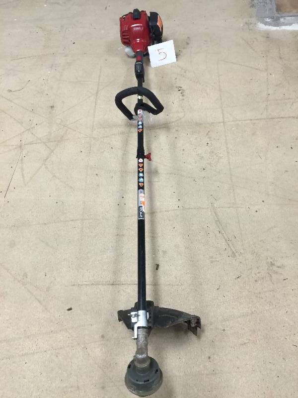 lot 5 image: Toro 2-Cycle 25.4cc Attachment Capable Straight Shaft Gas String Trimmer in like New working conditions Model # 51978