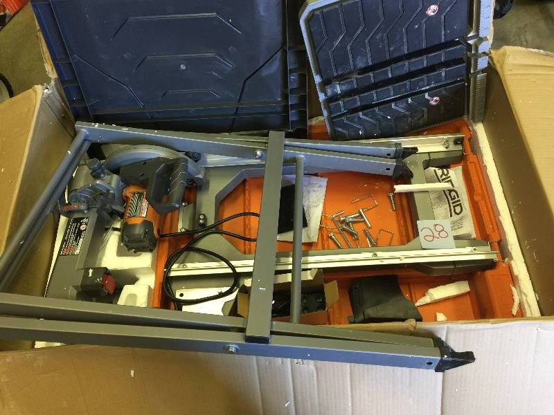 lot 28 image: RIDGID 8 in. Tile Saw with Stand Model # R4040S in like New working conditions