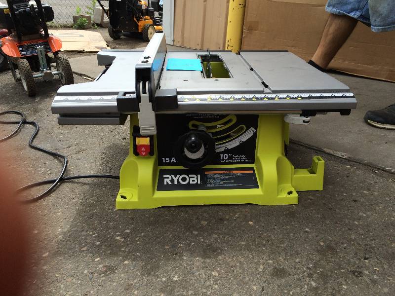 lot 6 image: Ryobi 10 in. Portable Table Saw  Model # RTS21G in like new workig conditions