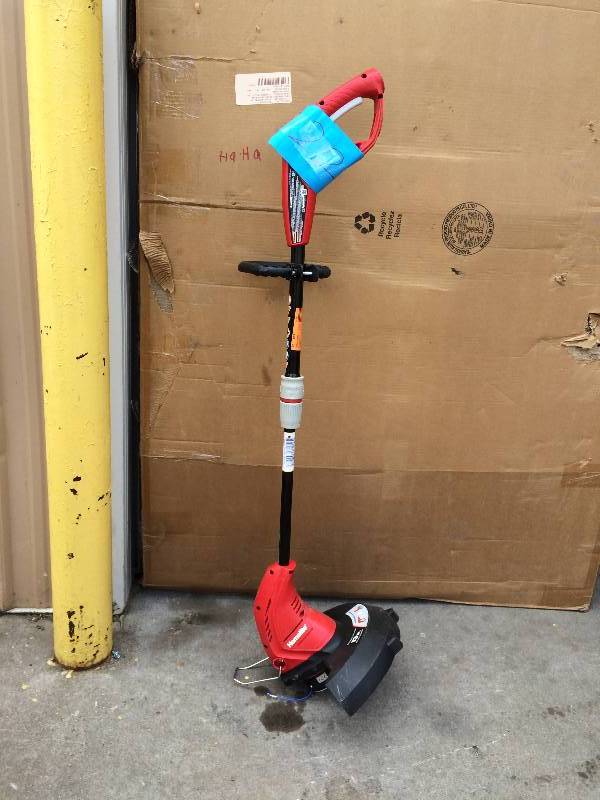 lot 22 image: Homelite 13 in. 4 Amp Straight Electric String Trimmer Model # UT41112B in working conditions