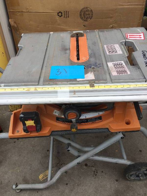 lot 31 image: Ridgid Heavy-Duty Portable Table Saw with Stand Model R4510  in working conditions