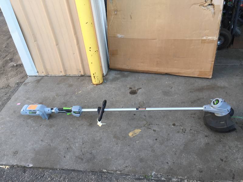 lot 42 image: Ego 15 in. 56-Volt Lithium-Ion Cordless Brushless String Trimmer in working conditions- Battery and Charger Not Included