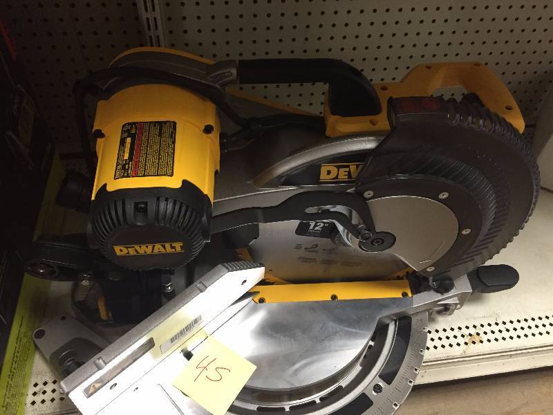 lot 45 image: Dewalt 15 Amp 12 in. Double-Bevel Compound Miter Saw DW716 in like new condition