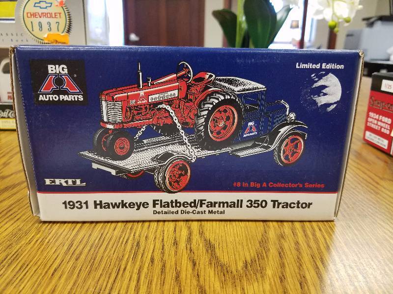 lot 30 image: 1931 Hawkeye FlatbedFarmall 350 Tractor Big A Auto Parts by Ertl