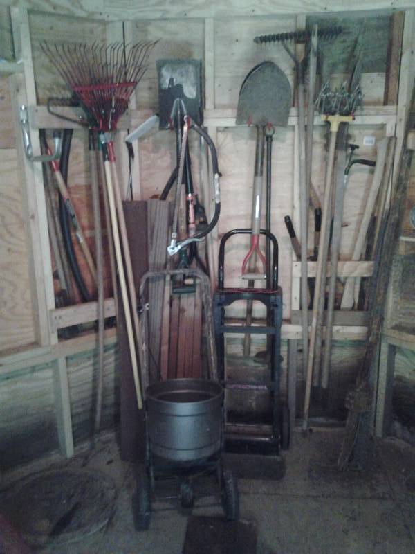 All Implements On Wall Shovels, Rakes, 2-Wheeler, Spreader, Fence Post, Post Hole Digger, Weed Weasel
