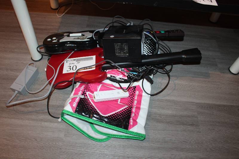lot 30 image: Lot of Game Controllers Including Air Guitars, And More