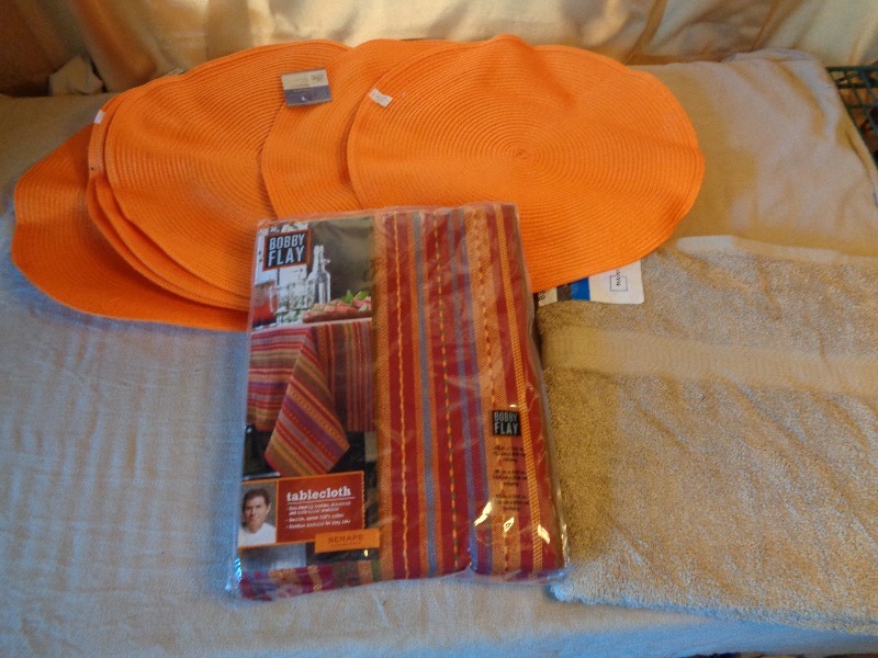 lot 71 image: New Bobby Flay Tablecloth, New Towel, and Placemats