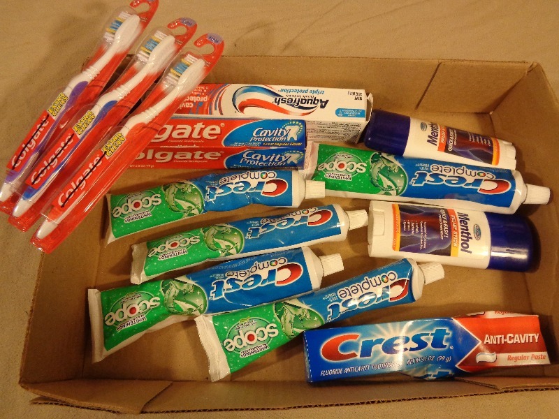 lot 90 image: New Toothbrushes, Relief Sticks,  and Toothpastes