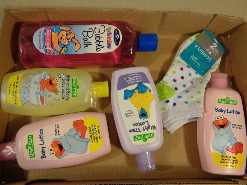 lot 123 image: New Baby Lotion, Bubble Bath, and More