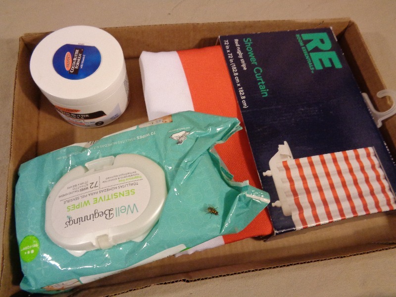 lot 138 image: New Cocoa Butter, New Shower Curtain, and New Baby Wipes