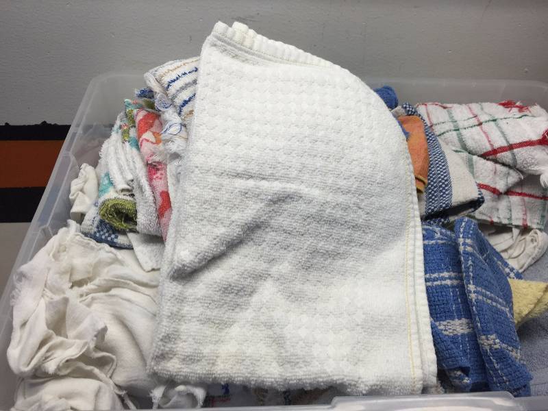 lot 29 image: FULL CONTAINER OF WASH CLOTHS, DISH TOWELS AND TOWELS