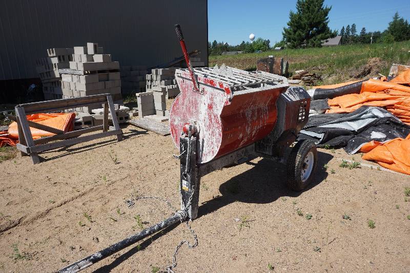 lot 18 image: Stone Toro Model MMX1158H Single Axle Pull Behind Barrel Cement Mixer