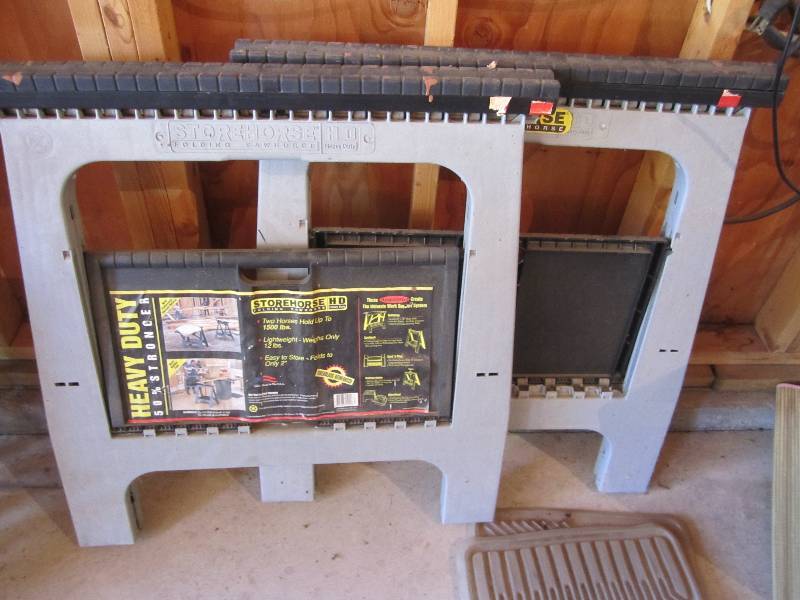lot 19 image: 2 folding plastic saw horses...