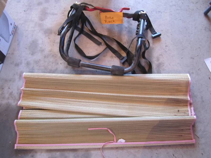 lot 21 image: Bike rack and car window shade...